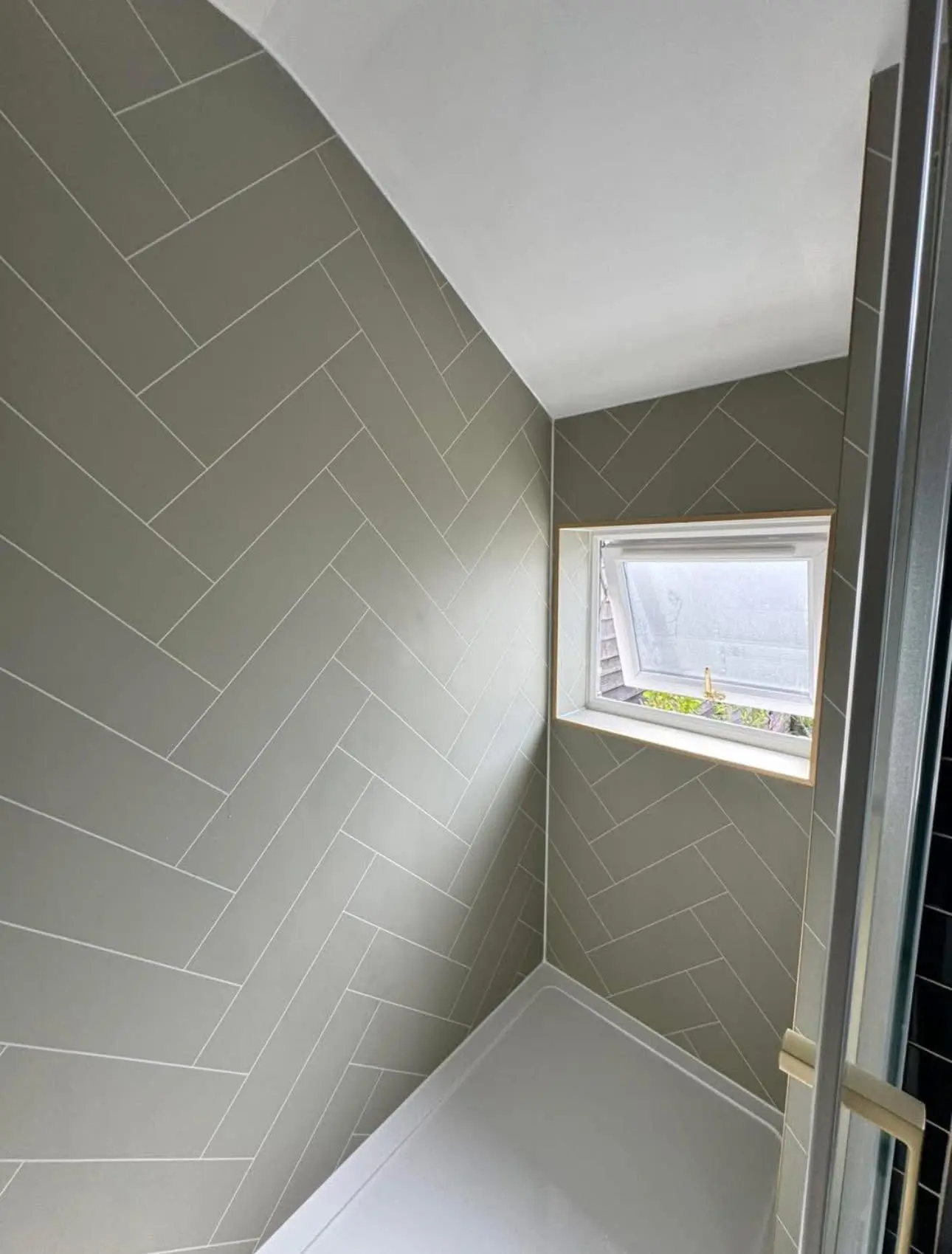Bathroom fitting Barnet — herringbone shower tiles with gold fixtures — Resale Refurbs Ltd