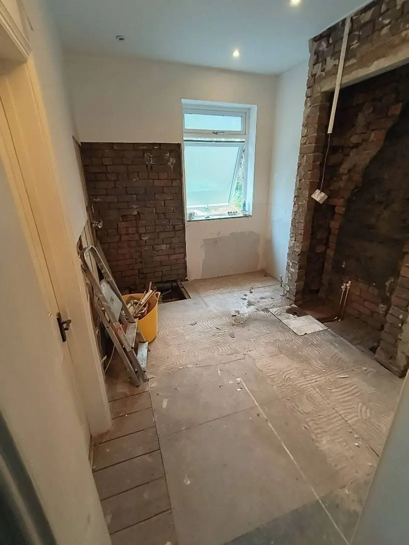 Bathroom fitting Enfield before - room stripped to brick ready for full installation - Resale Refurbs Ltd