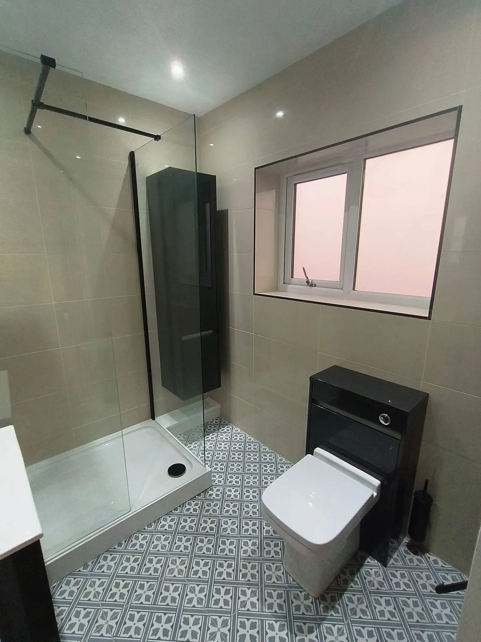Bathroom fitting Enfield complete room with matte black fixtures, patterned floor tiles and walk-in shower - Resale Refurbs Ltd