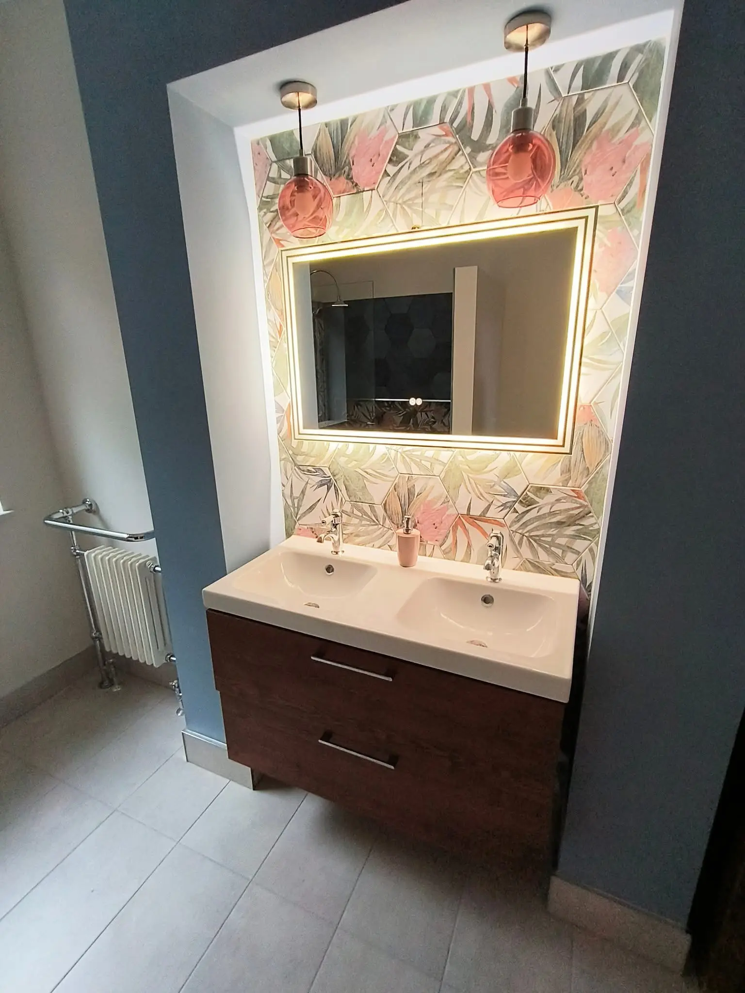 Bathroom fitting Enfield feature niche with tropical hex tiles, lit mirror and double sinks - Resale Refurbs Ltd