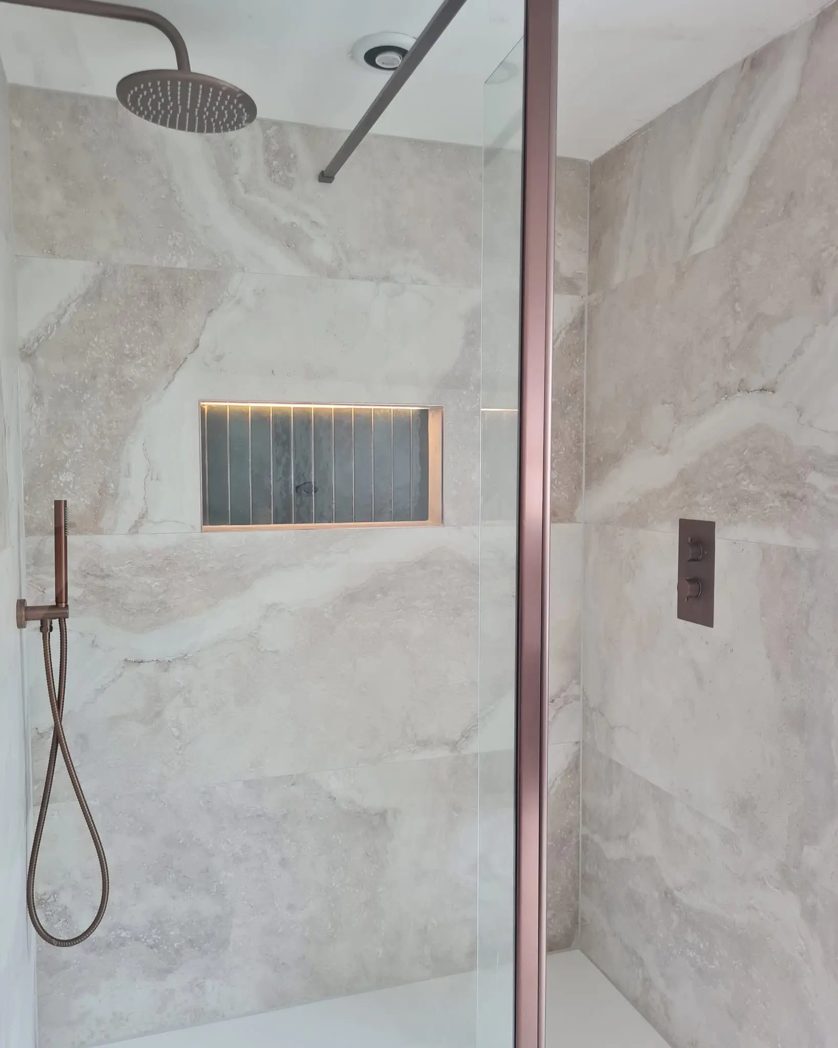 Bathroom installation Barnet - premium walk-in shower with rainfall head and stone effect tiles by Resale Refurbs Ltd