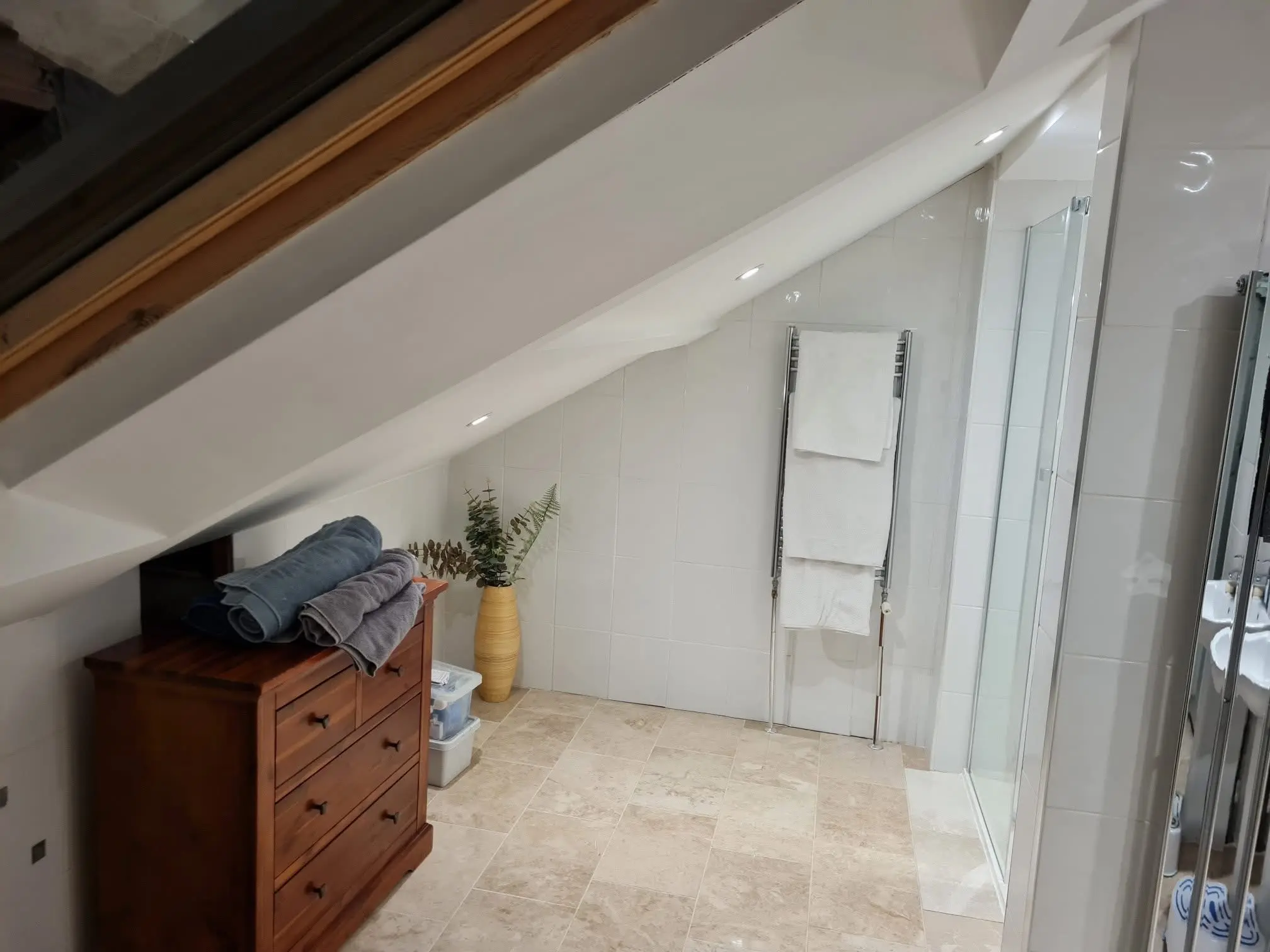 House refurbishment Barnet loft bathroom with skylight and walk-in shower - Resale Refurbs Ltd