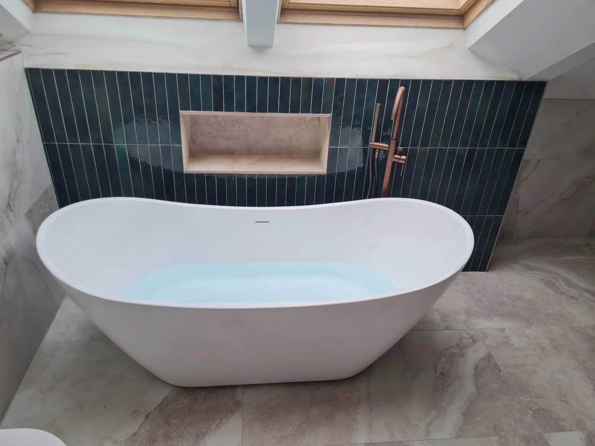 House refurbishment Barnet luxury bathroom with freestanding bath, teal tiles and copper fixtures - Resale Refurbs Ltd