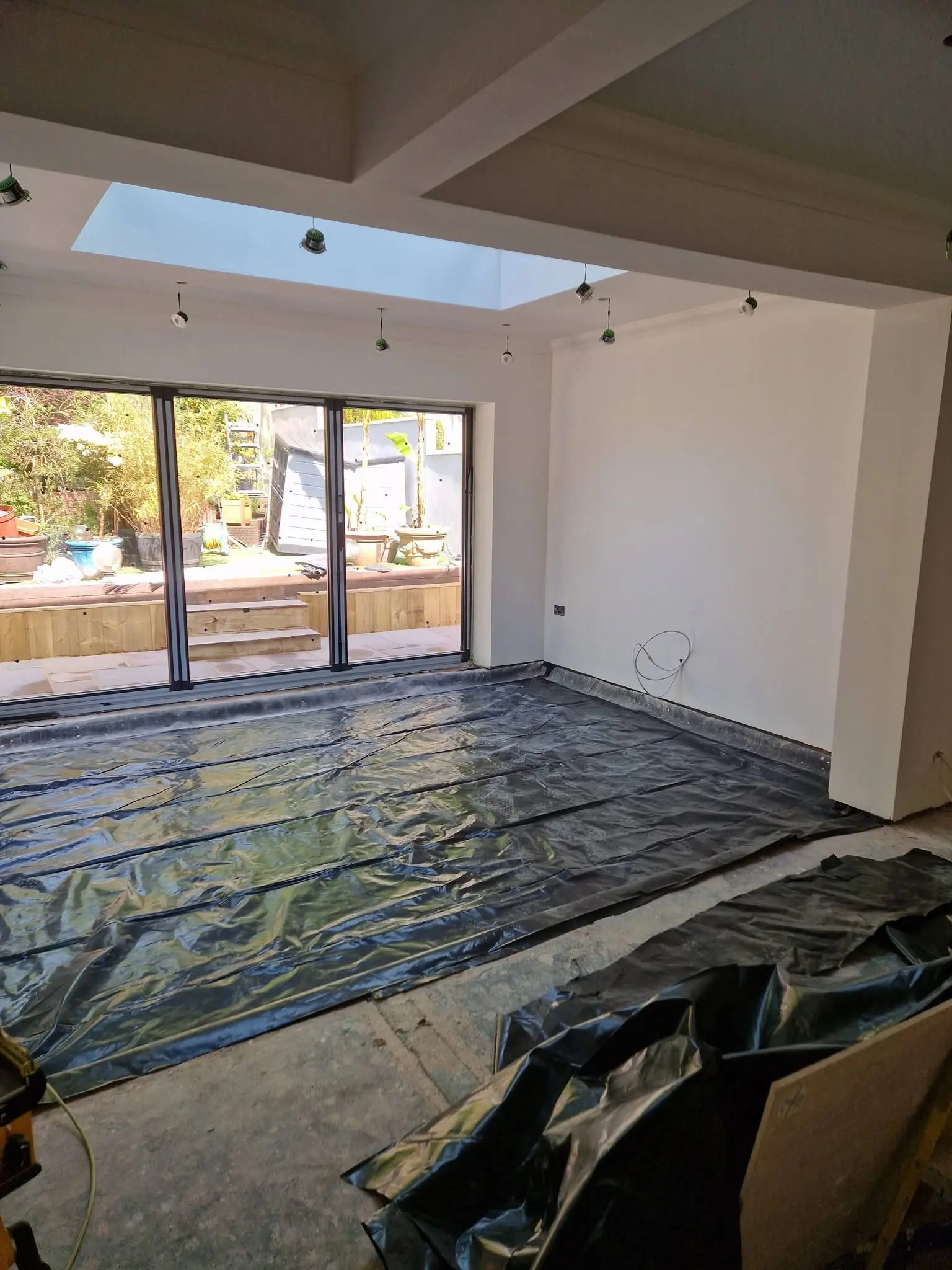 House refurbishment Enfield rear extension during build with lantern roof structure in place - Resale Refurbs Ltd