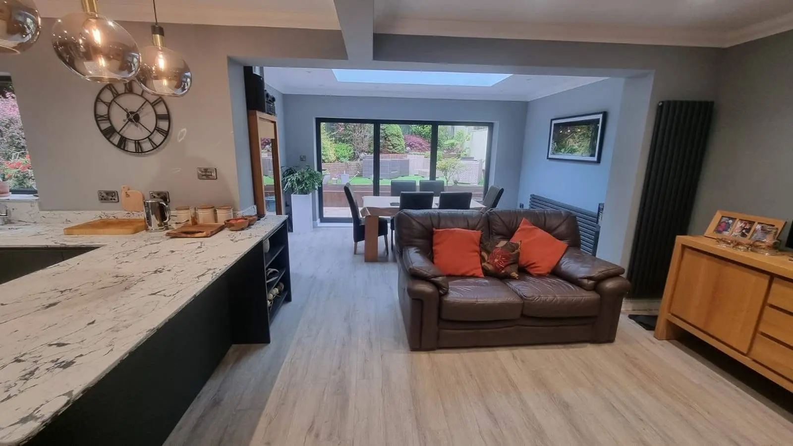 House refurbishment Enfield open plan kitchen and living area with island and bifold doors - Resale Refurbs Ltd