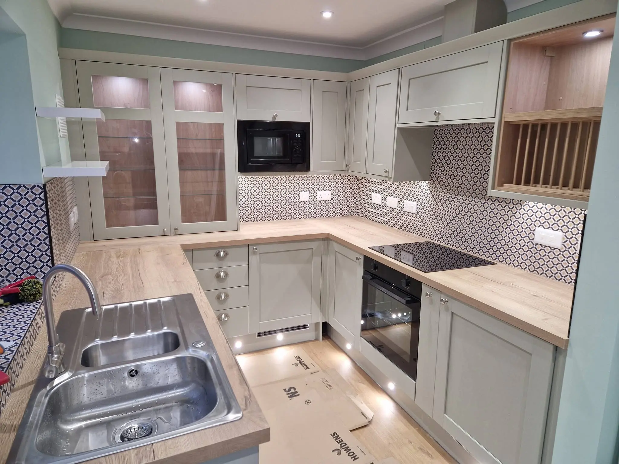 House refurbishment Enfield sage green shaker kitchen complete with patterned tile splashback - Resale Refurbs Ltd