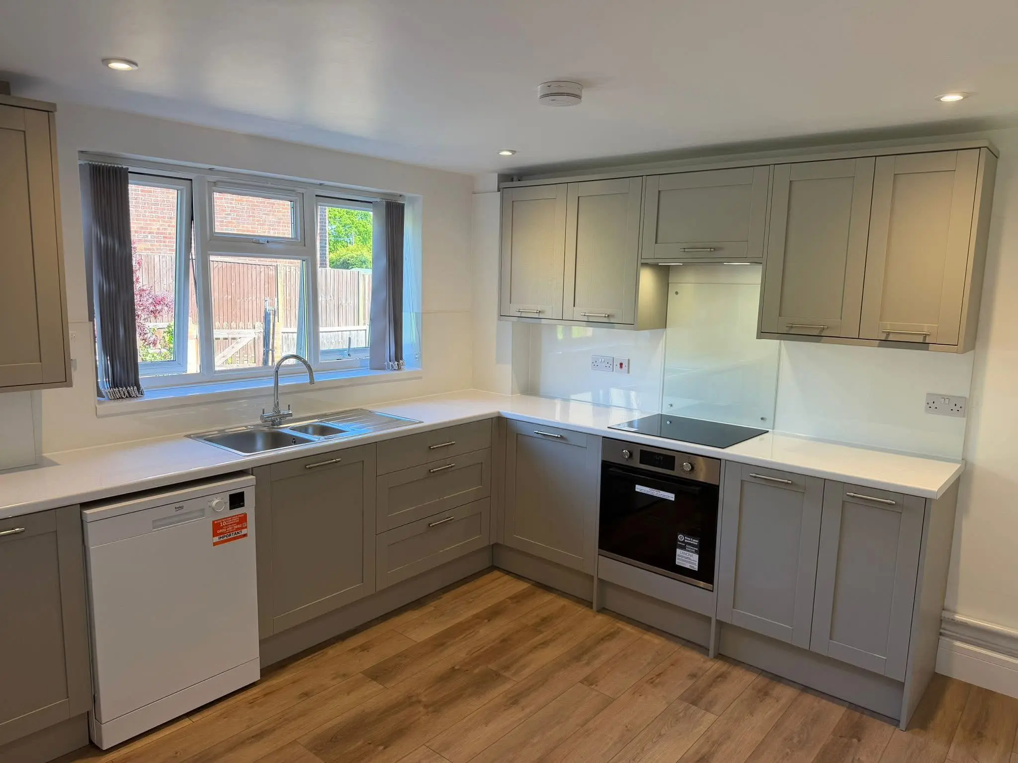 Kitchen fitting Barnet - grey shaker kitchen with white quartz worktop installed by Resale Refurbs Ltd