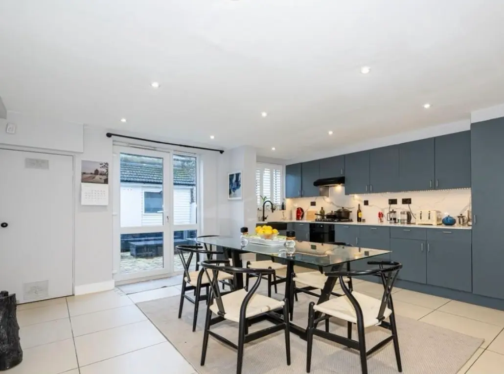 Open plan kitchen refurbishment Barnet London with grey cabinets and marble splashback — Resale Refurbs Ltd