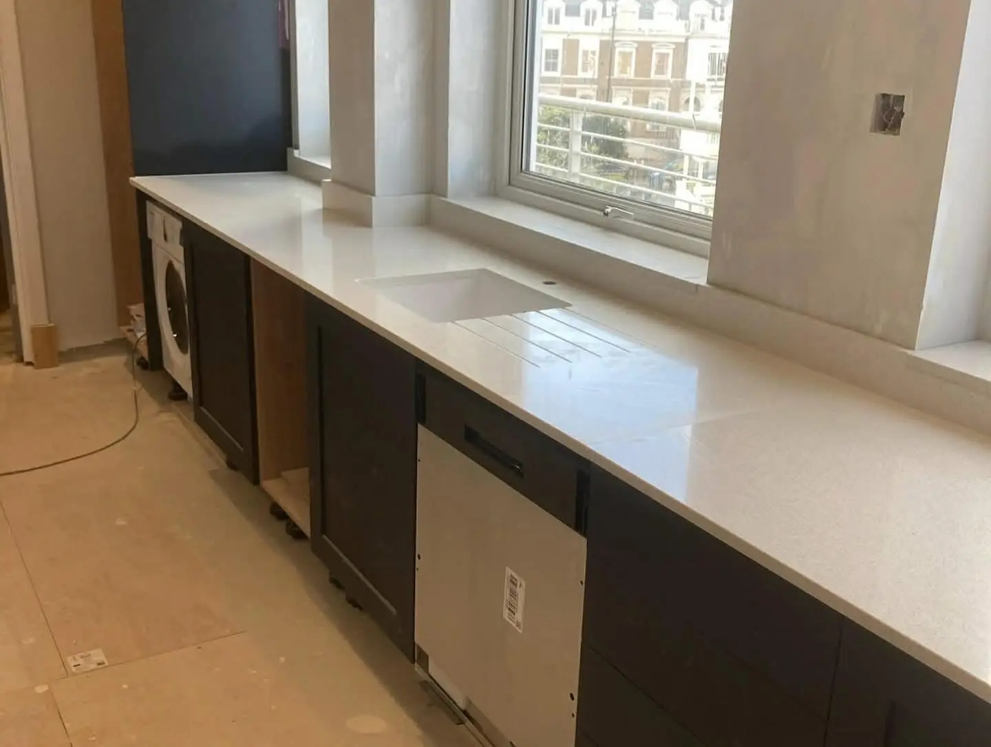 Kitchen worktop fitting Barnet - white quartz worktop with undermount sink installed by Resale Refurbs Ltd